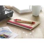 Recycled paper notepad with colour detail and pen, B6 red colour main ambient view