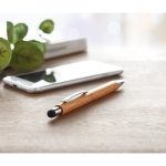 Sustainable bamboo stylus pen with blue ink & laser engraving ambient view