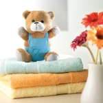 Stuffed animal teddy bear, dungarees for children blue colour ambient view