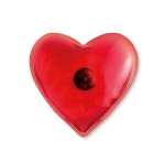 Winter hand warmer in a red heart shape warms with pressure red colour