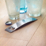 Elegant curved bottle opener, stainless steel matt silver colour ambient view