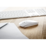 Battery-operated wireless mouse, glossy plastic white colour ambient view