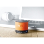 Round Bluetooth speaker with coloured LEDs orange colour fourth ambient view 2