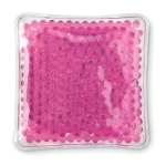 Massage bag filled with balls use as a cold-warm compress transparent red colour