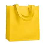 Affordable non-woven bag with short handles, 80 g/m2 yellow colour