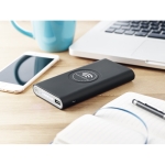 Wireless charging power bank with rubberized finish, 8,000 mAh black colour ambient view