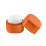 Ball-shaped lip balm in a box made of ABS, SPF 15 orange colour