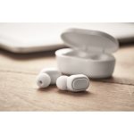 Earphones with Bluetooth and charger case white colour ambient view