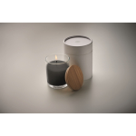 Vanilla scented candle in a glass for gifting black colour photographic view