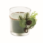 Candle in glass candleholder with festive forest decorations green colour second view