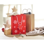 Medium red gift bag with a white snowflake motif red colour ambient view