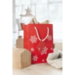 Medium red gift bag with a white snowflake motif red colour second ambient view