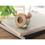 Bamboo case clock that works without a battery transparent grey colour main ambient view