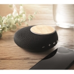 High quality 5.0 wireless speaker with phone charger black colour ambient view