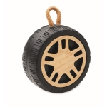 Wireless speaker in the shape of a tyre with a hand strap wood colour