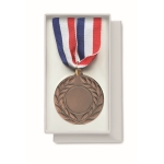 Medal made of iron in the 3 colors blue, white, and red brown colour