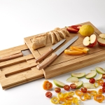 Bamboo chopping board with sliding tray and three knives natural colour ambient view