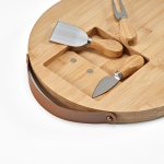 Bamboo chopping board with handle and three utensils natural colour third view