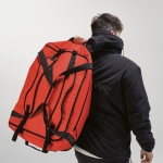 Sports bag made of RPET with black reflective straps red colour ambient view