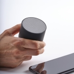 Portable speaker made from recycled plastic black colour ambient view